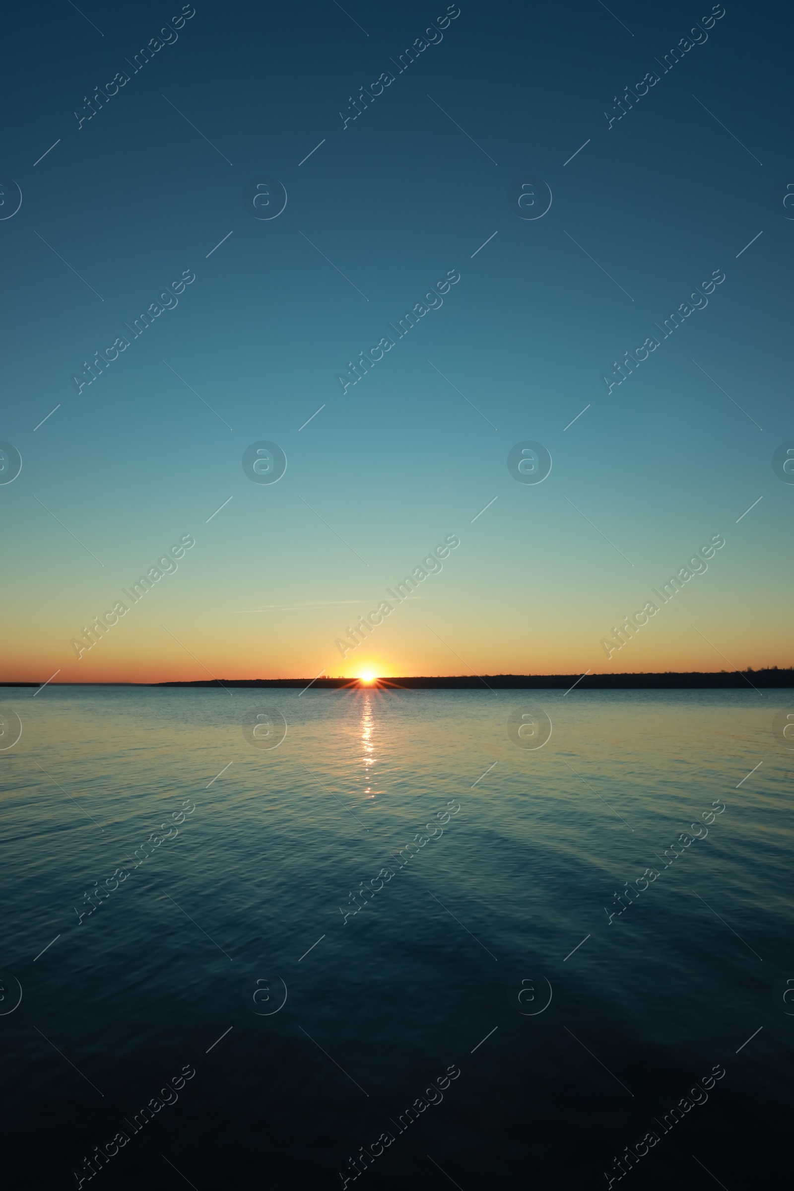 Photo of Picturesque view of beautiful sunset over calm river