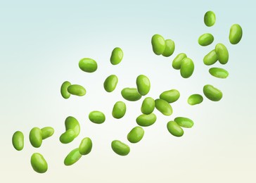 Image of Delicious edamame soybeans flying on color background