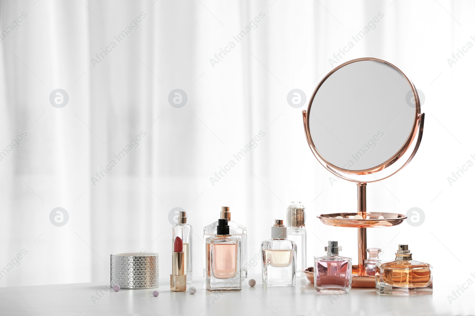 Photo of Perfume bottles on dressing table