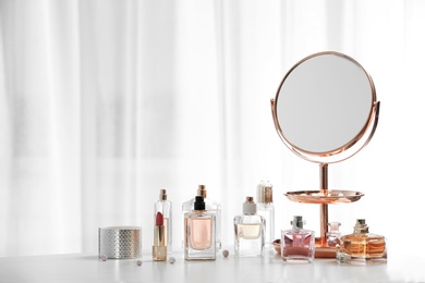 Photo of Perfume bottles on dressing table