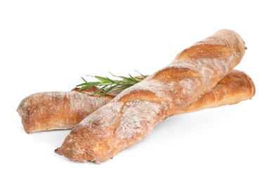 Photo of Crispy French baguettes with rosemary on white background. Fresh bread