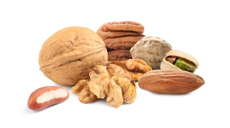 Image of Mix of different tasty nuts on white background