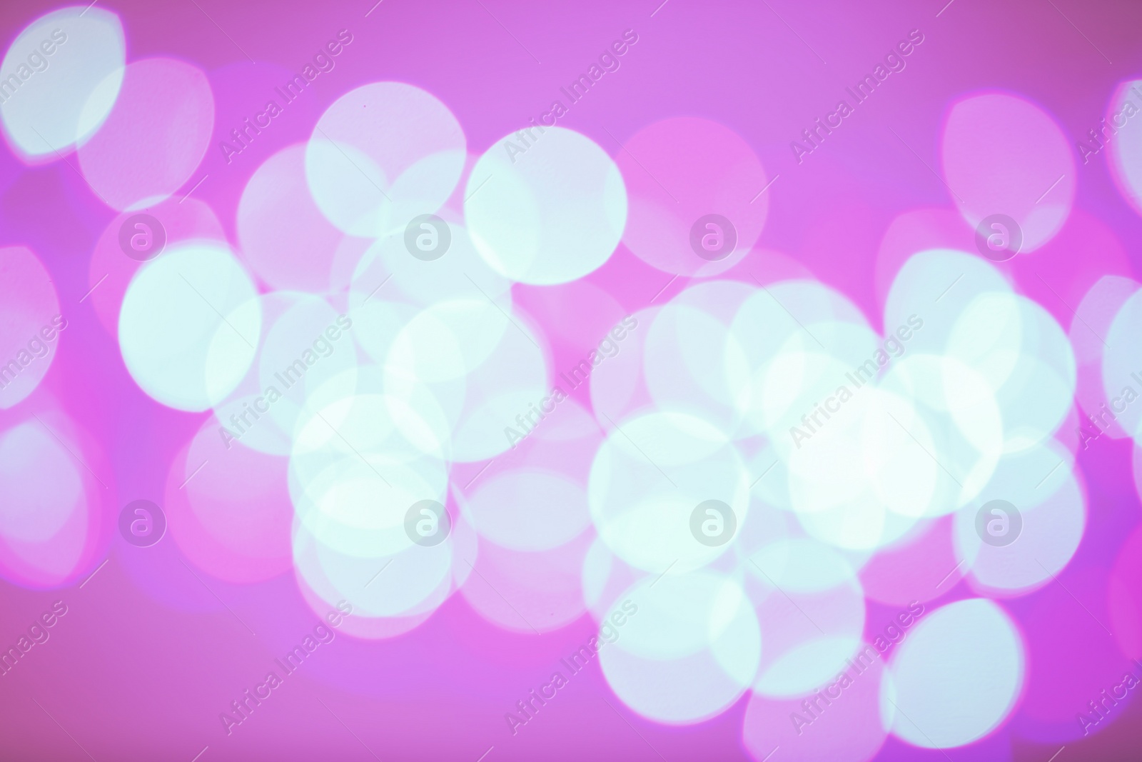 Photo of Beautiful glowing lights as background. Bokeh effect