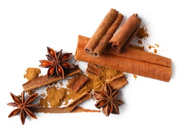 Photo of Dry aromatic cinnamon sticks, powder and anise stars isolated on white, top view