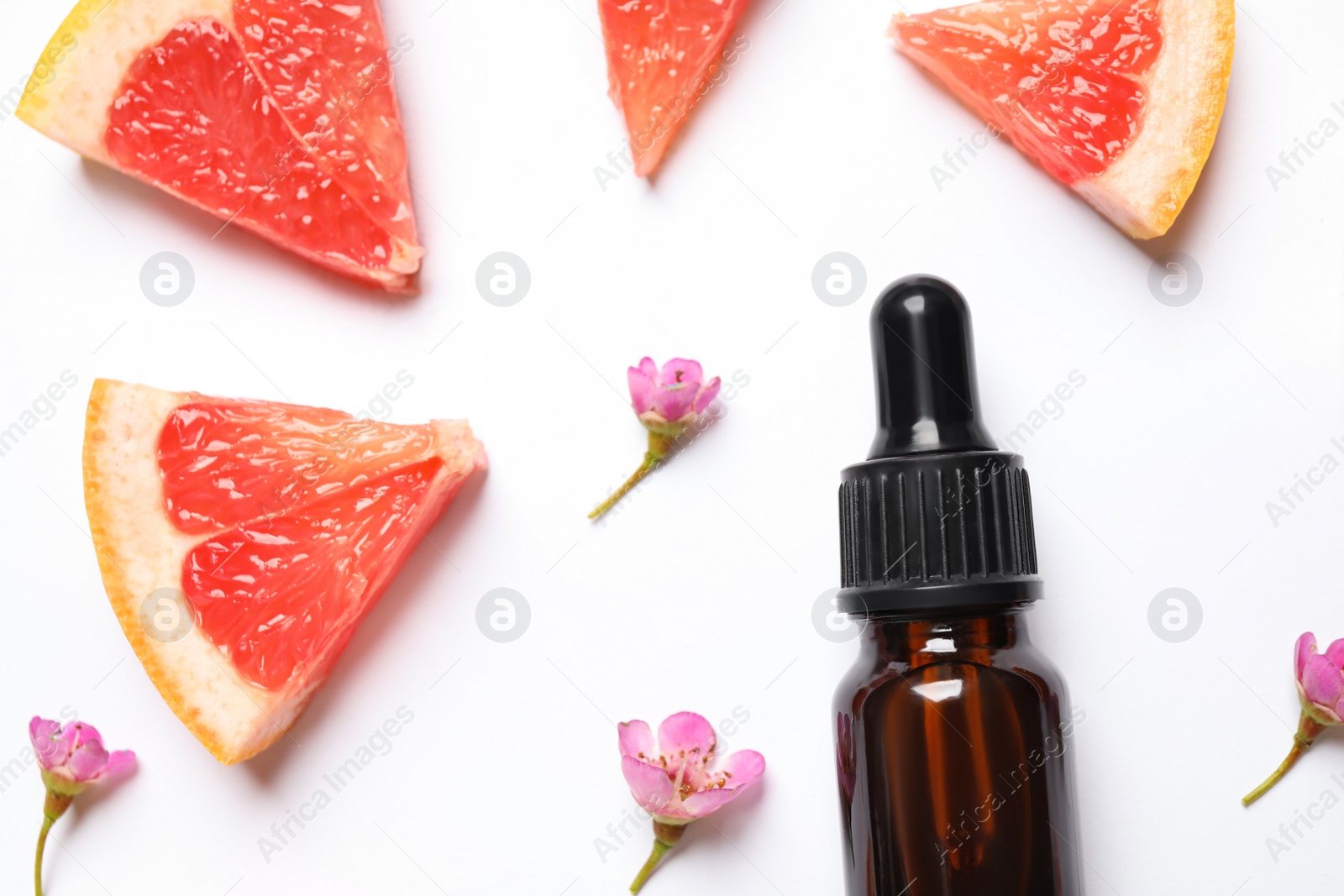 Photo of Flat lay composition with bottle of citrus essential oil on white background