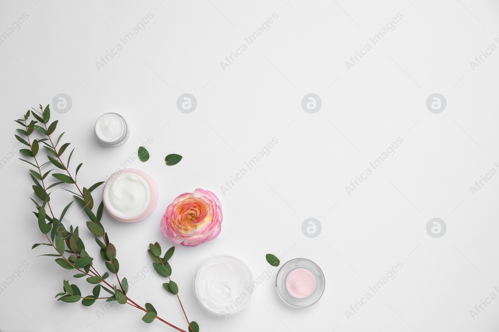 Photo of Flat lay composition with cosmetic products on light background