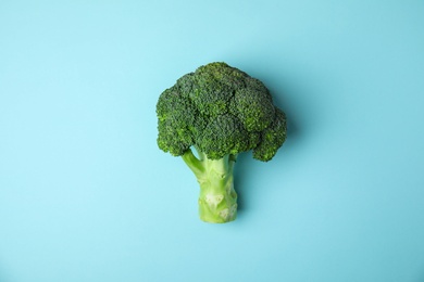 Photo of Fresh green broccoli on color background, top view. Organic food