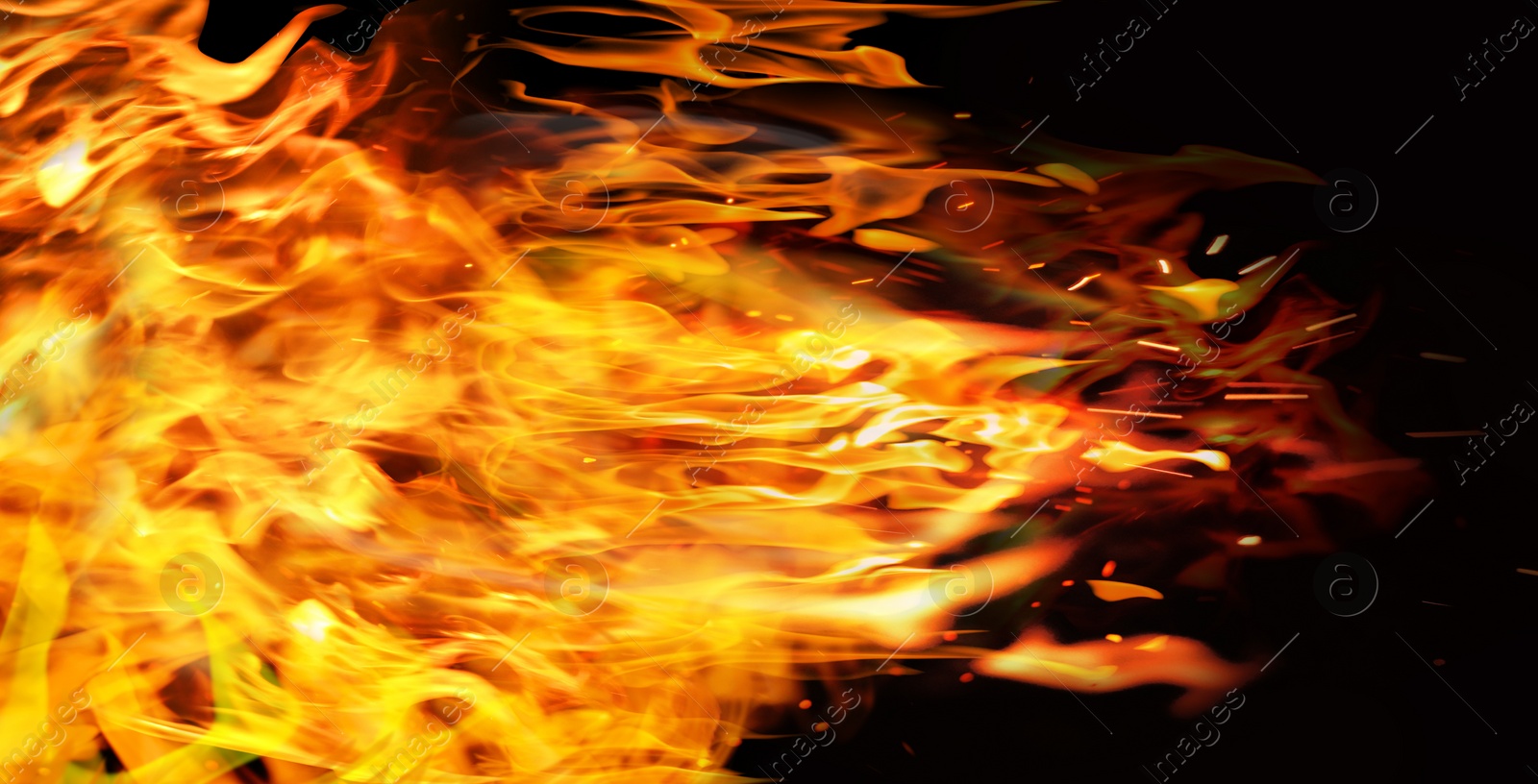 Image of Beautiful bright fire flames on black background. Banner design