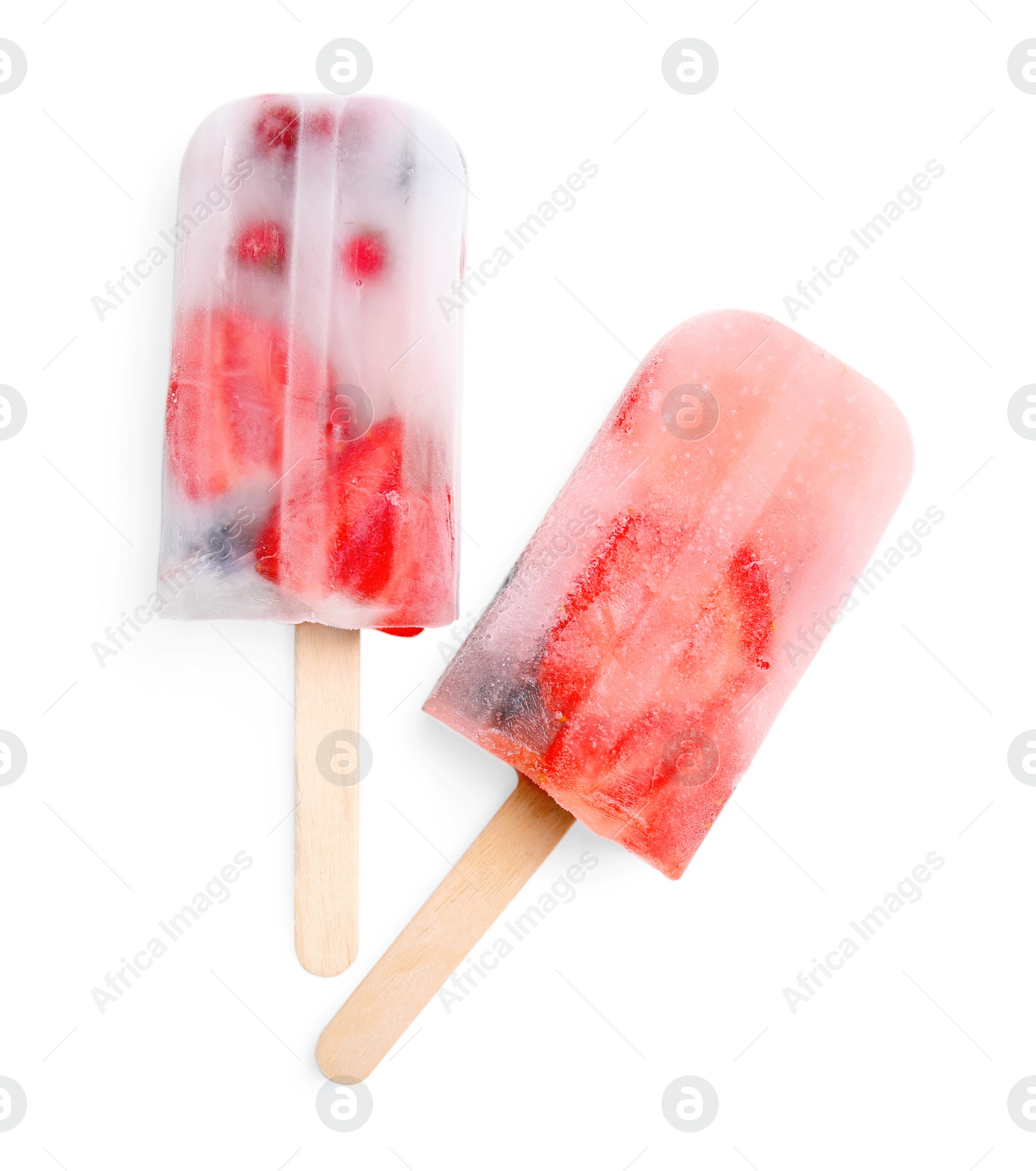 Photo of Tasty berry popsicles on white background, top view