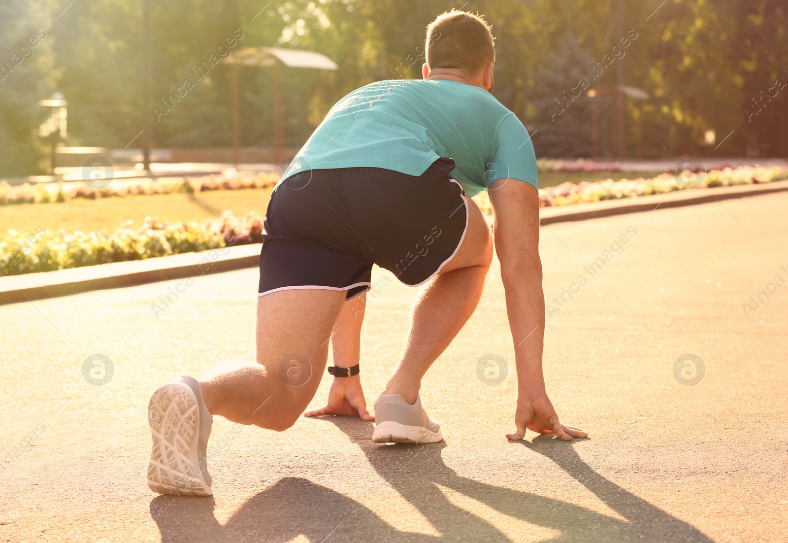 Photo of Young man ready for running outdoors on sunny day