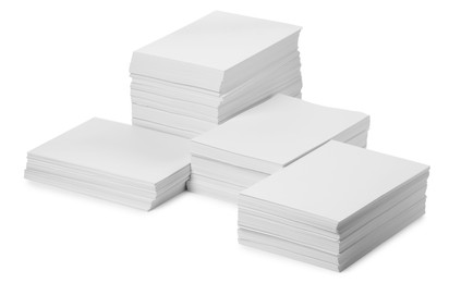 Photo of Stacks of paper sheets on white background