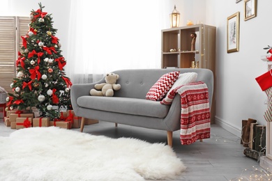 Photo of Living room interior with decorated Christmas tree