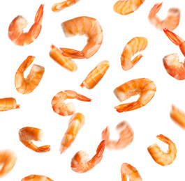 Image of Falling delicious freshly cooked shrimps on white background