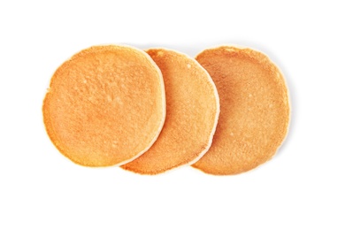 Hot tasty pancakes on white background, top view