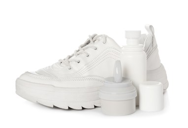 Photo of Composition with stylish footwear and shoe care accessories on white background