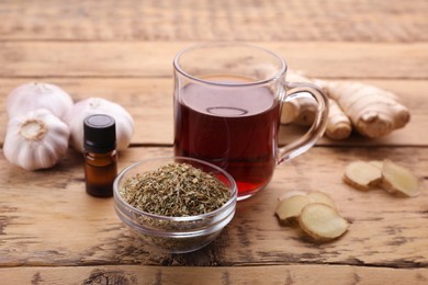 Cold remedies and syrup on wooden table, closeup. Cough treatment