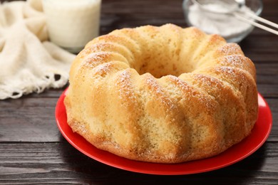 Photo of Delicious freshly baked sponge cake on wooden table, closeup