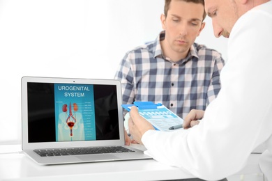 Photo of Man with health problems visiting urologist at hospital