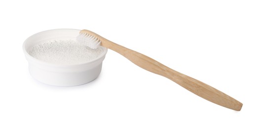 Photo of Bowl of tooth powder and brush on white background