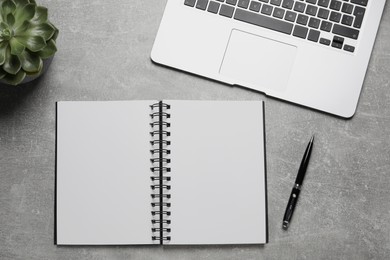 Photo of Flat lay composition with stylish notebook on grey table