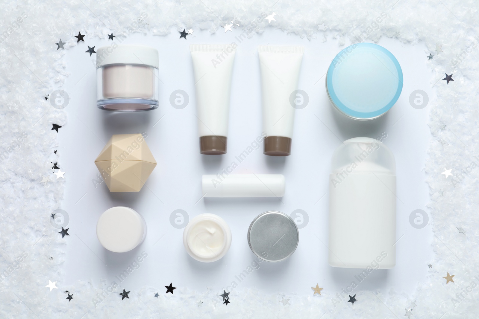 Photo of Set of cosmetic products on white background, flat lay. Winter care