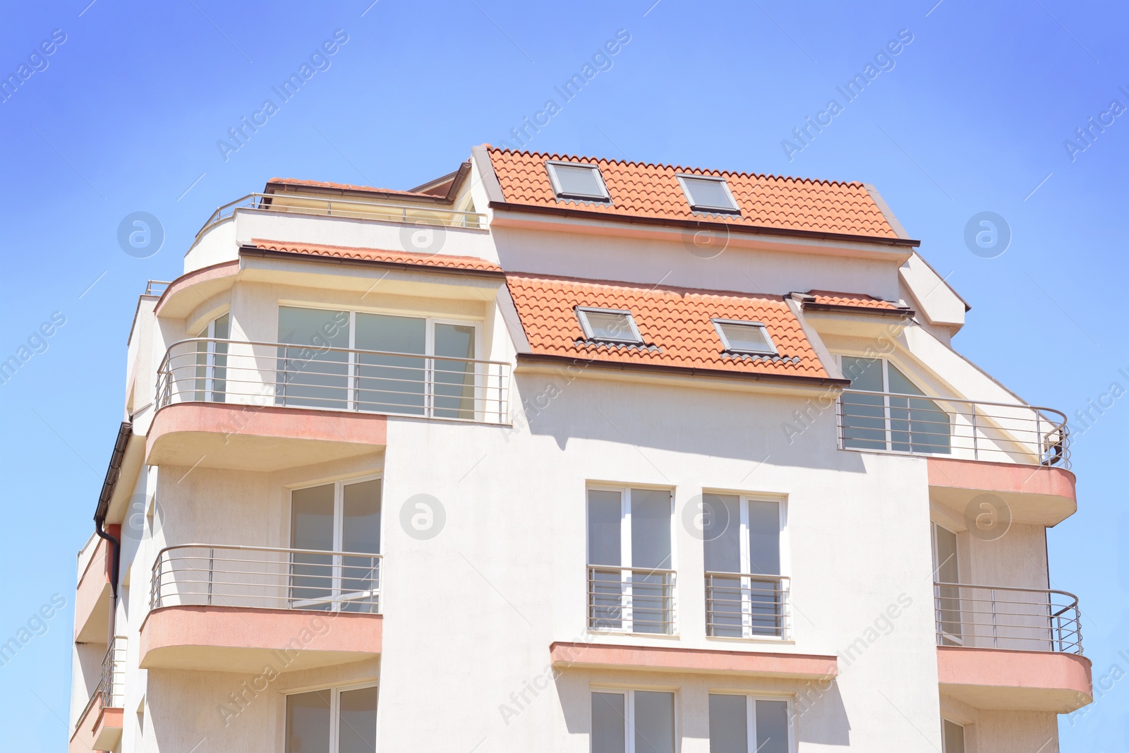 Photo of Exterior of beautiful residential building against blue sky