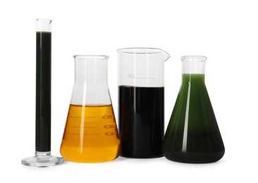 Test tube, beaker and flasks with different types of oil isolated on white