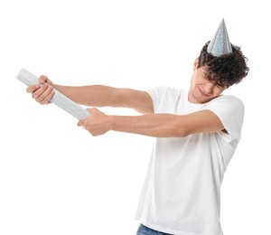 Photo of Emotional young man with party popper on white background