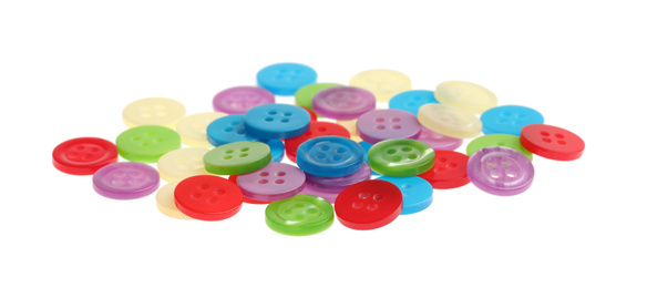 Photo of Many colorful sewing buttons on white background