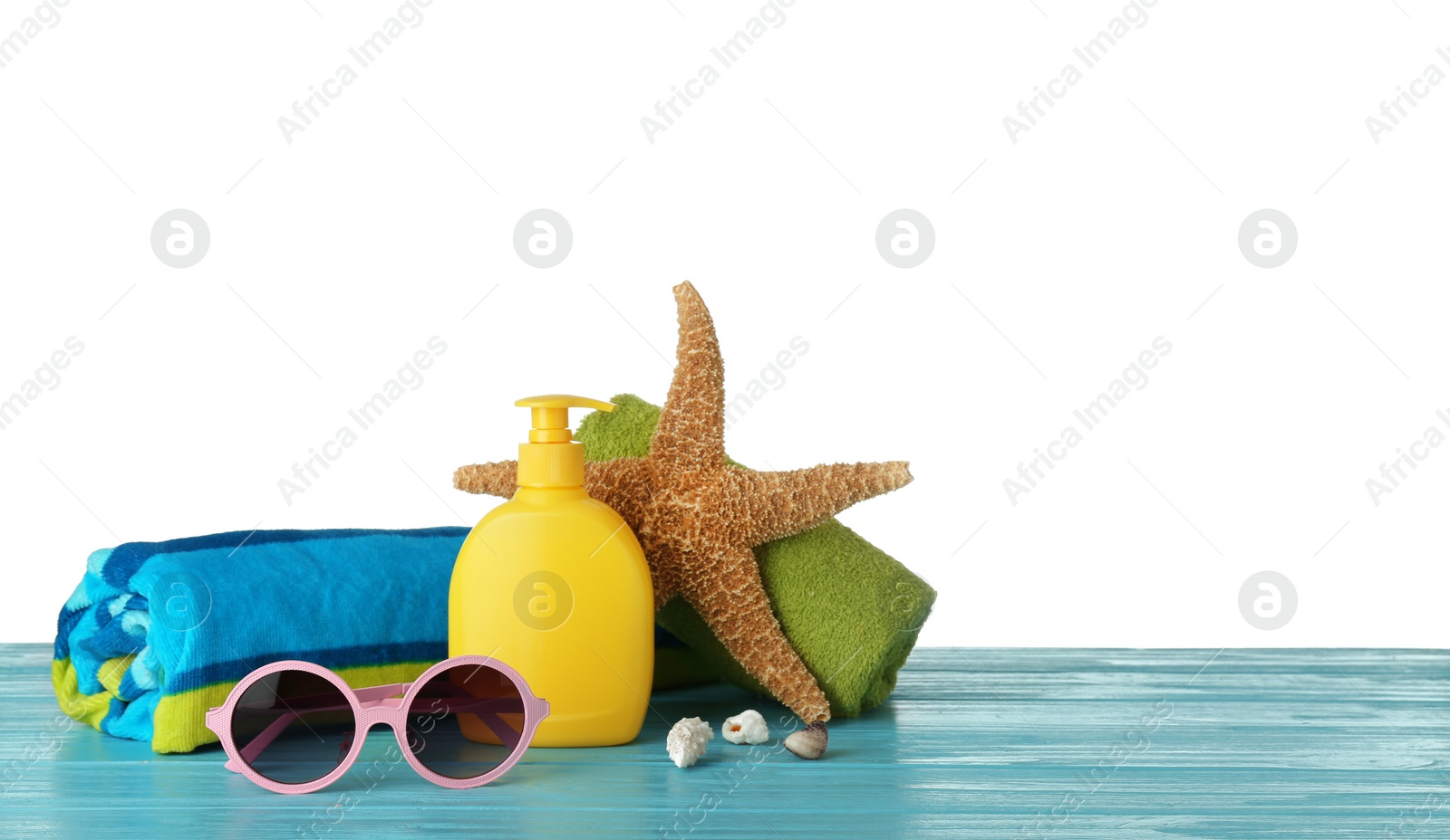 Photo of Set of different beach accessories on table against white background. Space for text