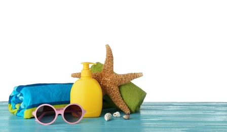 Photo of Set of different beach accessories on table against white background. Space for text