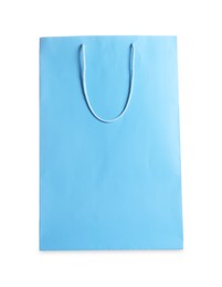 Photo of One light blue shopping bag isolated on white