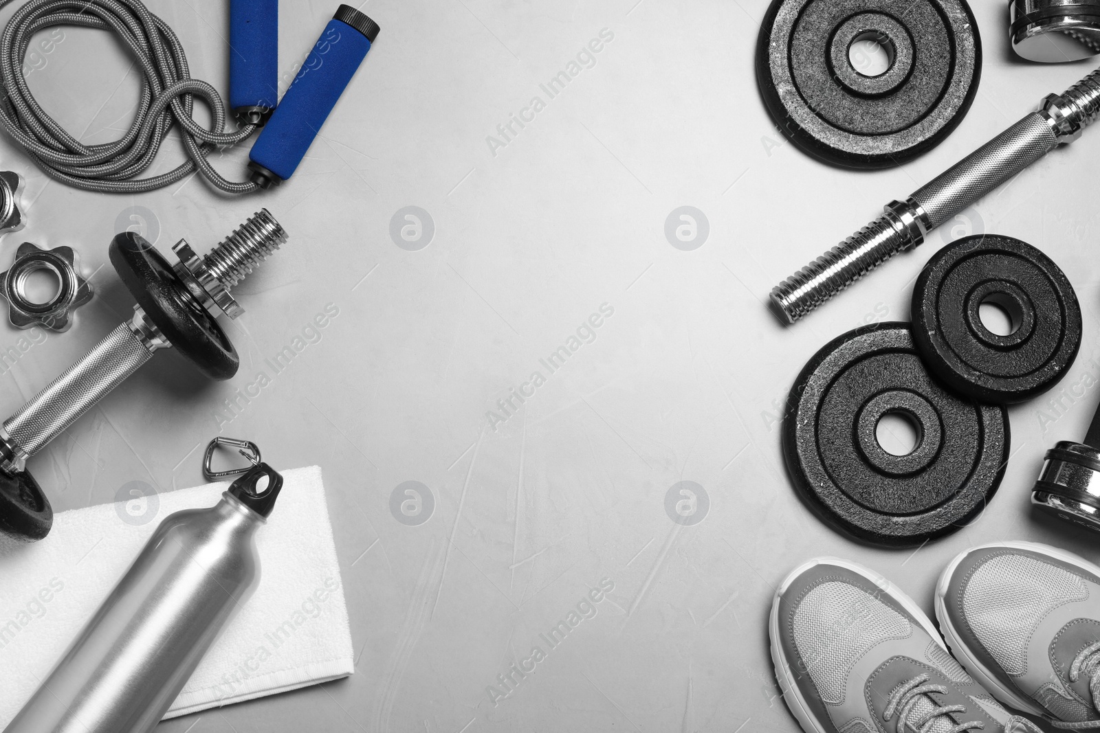 Gym equipment on light grey background, flat lay Photo of Gym equipment on light grey background, flat lay