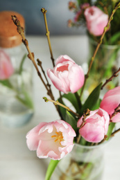 Photo of Beautiful bouquet with spring pink tulips on table, closeup