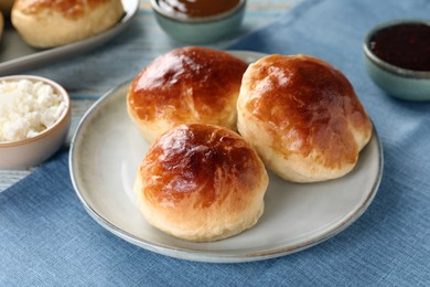 Tasty scones prepared on soda water and cottage cheese on table