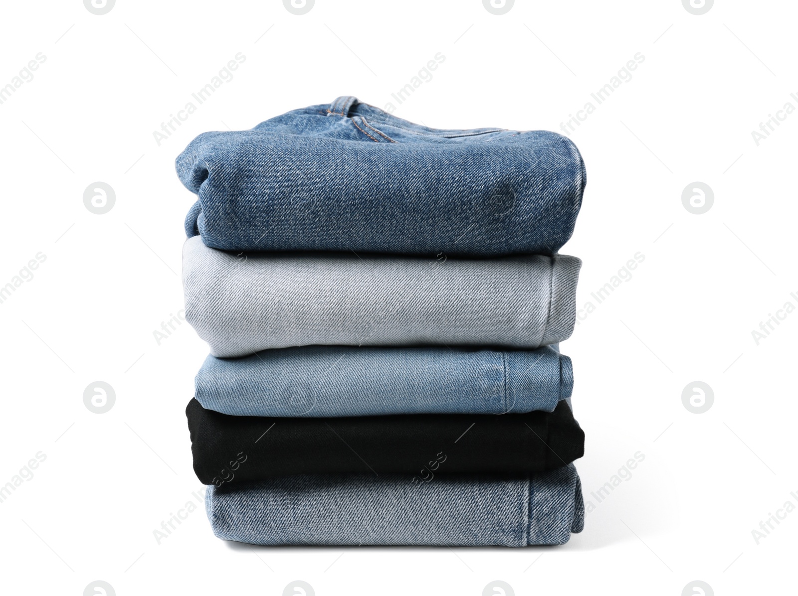 Image of Stack of different folded jeans isolated on white