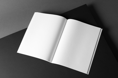 Photo of Empty book pages on dark background. Mockup for design