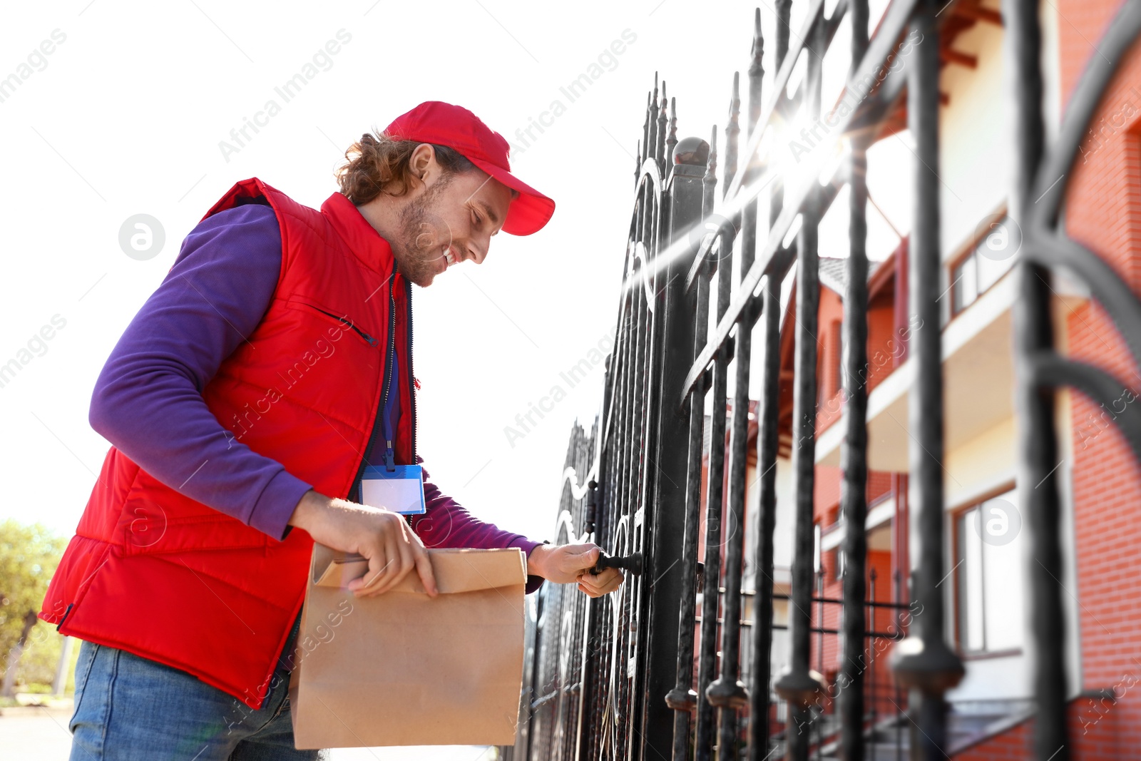 Photo of Male courier delivering food in city on sunny day