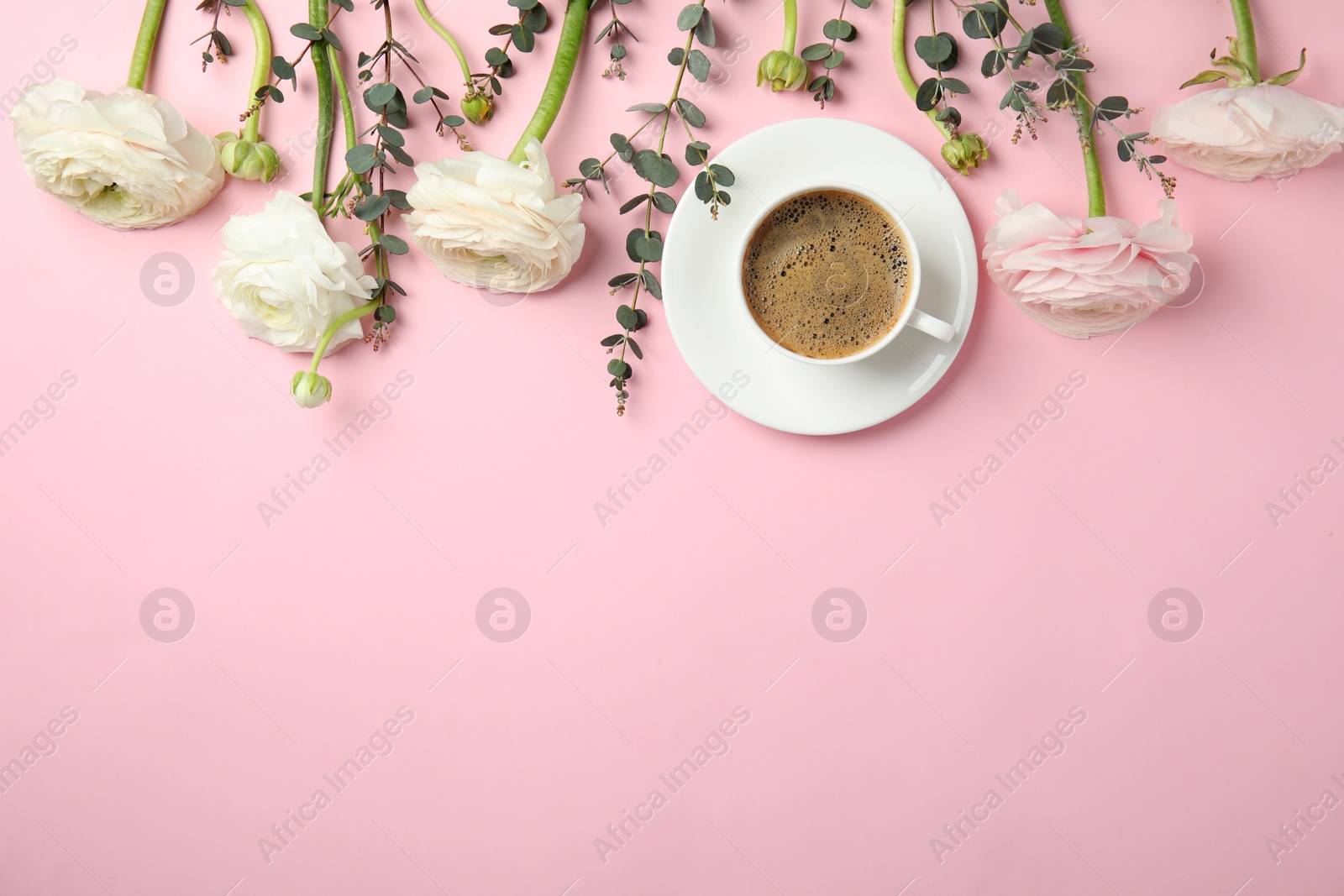Photo of Flat lay composition with spring ranunculus flowers and cup of coffee on color background. Space for text