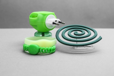 Photo of Set of different insect repellents on grey background