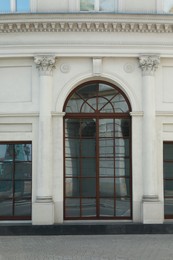 Photo of View of building with arched and ordinary windows