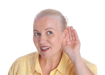Photo of Mature woman with hearing problem on white background