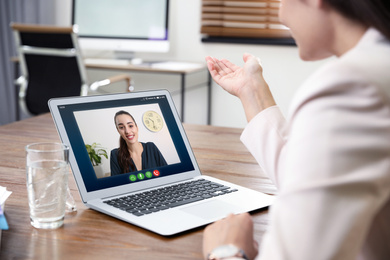 Image of Woman using video chat for online job interview in office, closeup 