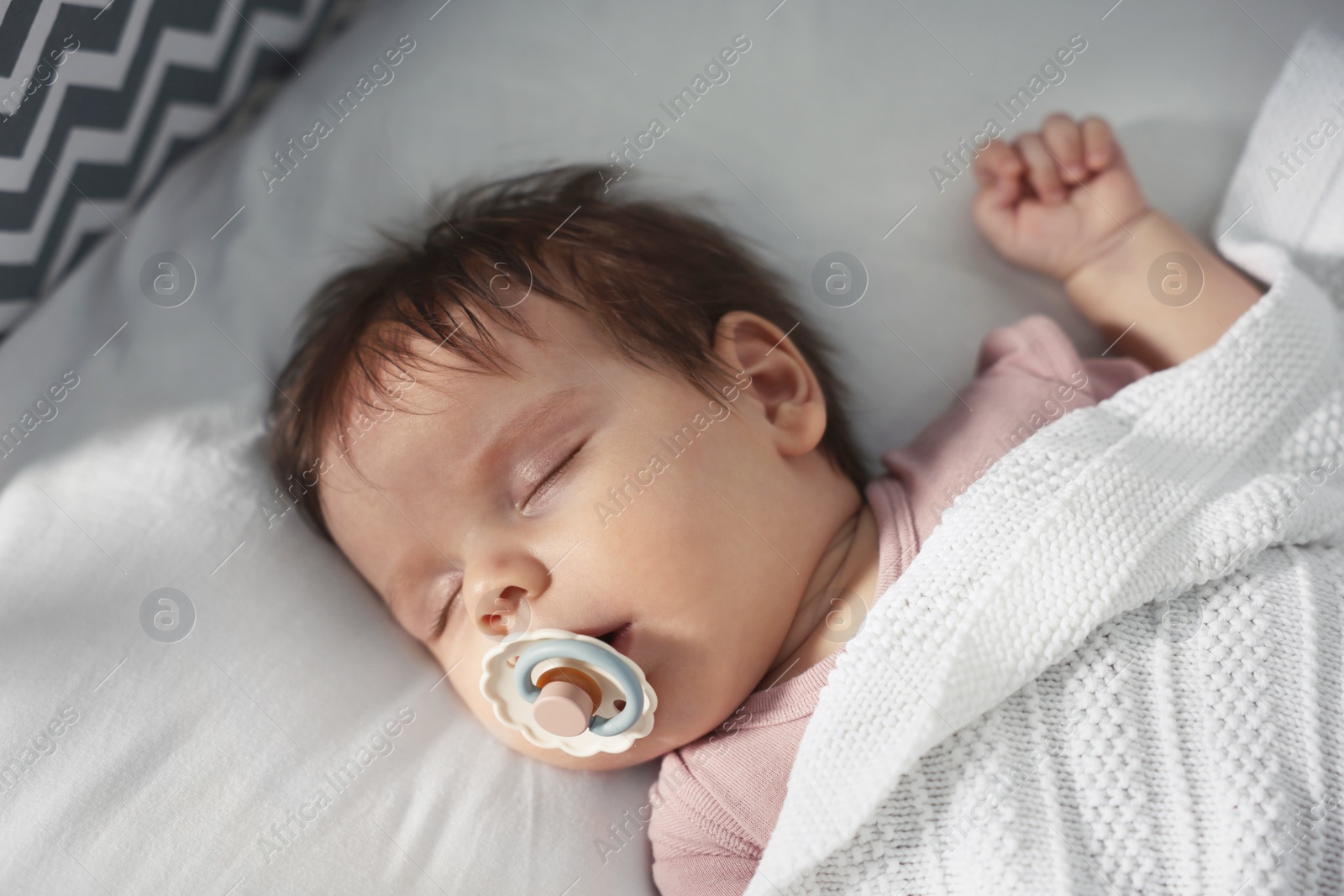 Photo of Cute little baby sleeping on cosy bed