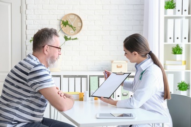 Female doctor consulting patient in clinic