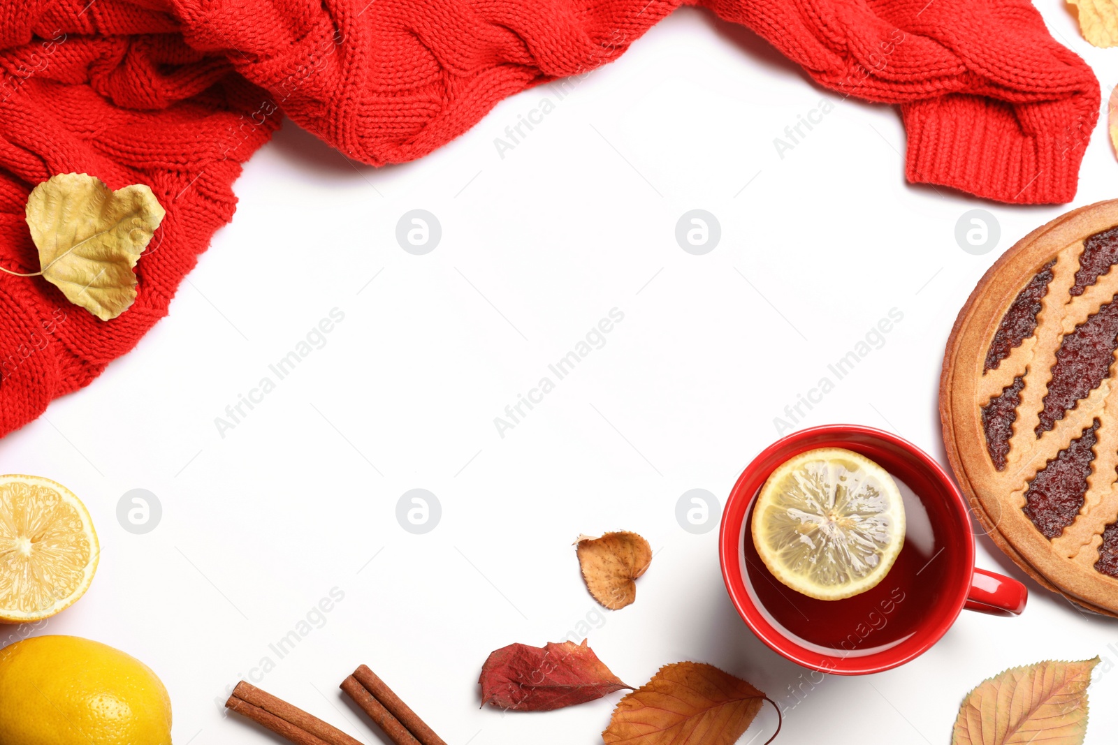 Photo of Flat lay composition with cup of hot drink on white background, space for text. Cozy autumn atmosphere