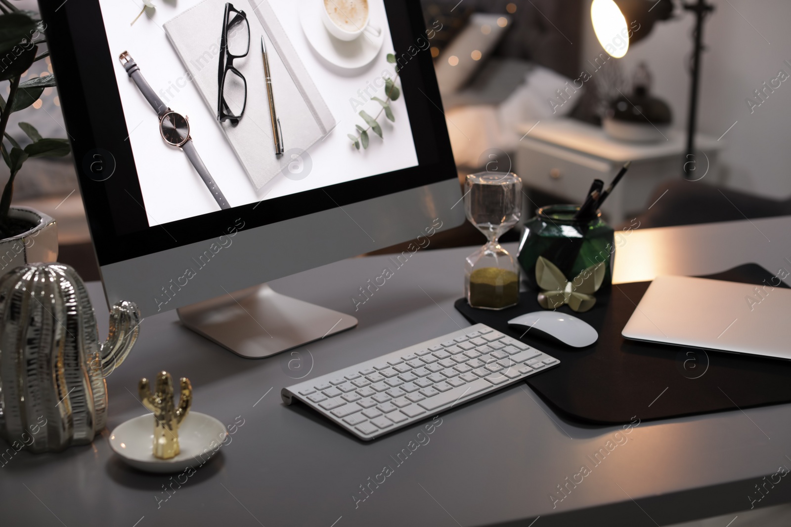 Photo of Stylish workplace interior with modern computer on desk