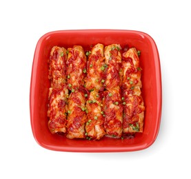 Baking dish of delicious stuffed cabbage rolls cooked with homemade tomato sauce isolated on white, top view