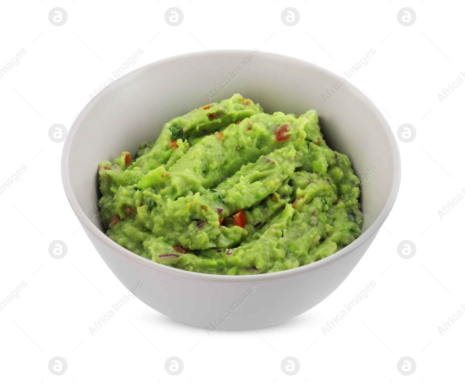 Photo of Bowl of delicious guacamole isolated on white