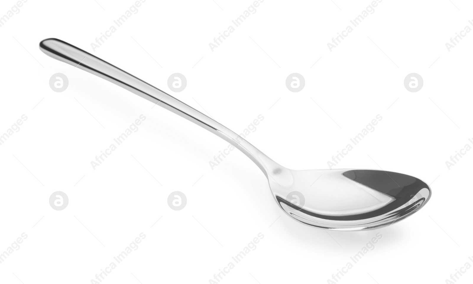 Photo of One shiny silver spoon isolated on white